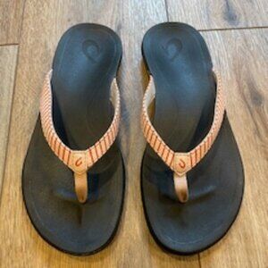 OLUKAI flip flops size 7. Black with pink/red striped thong